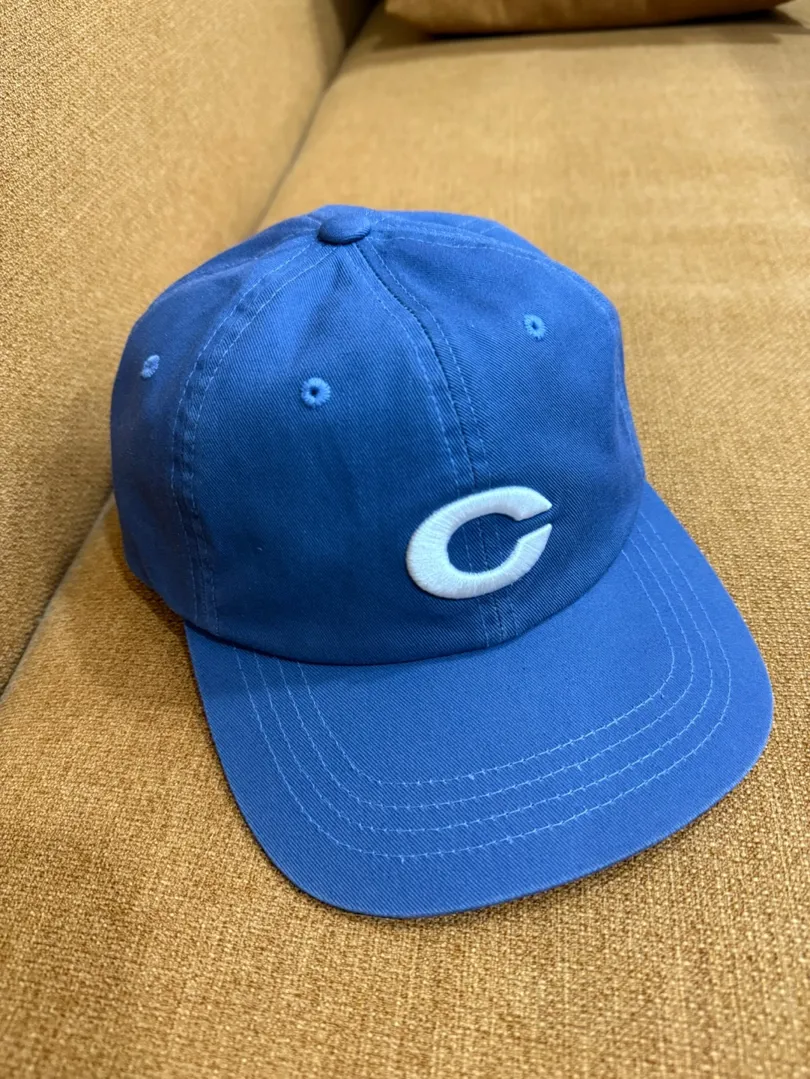 Selling CRITIC hats.